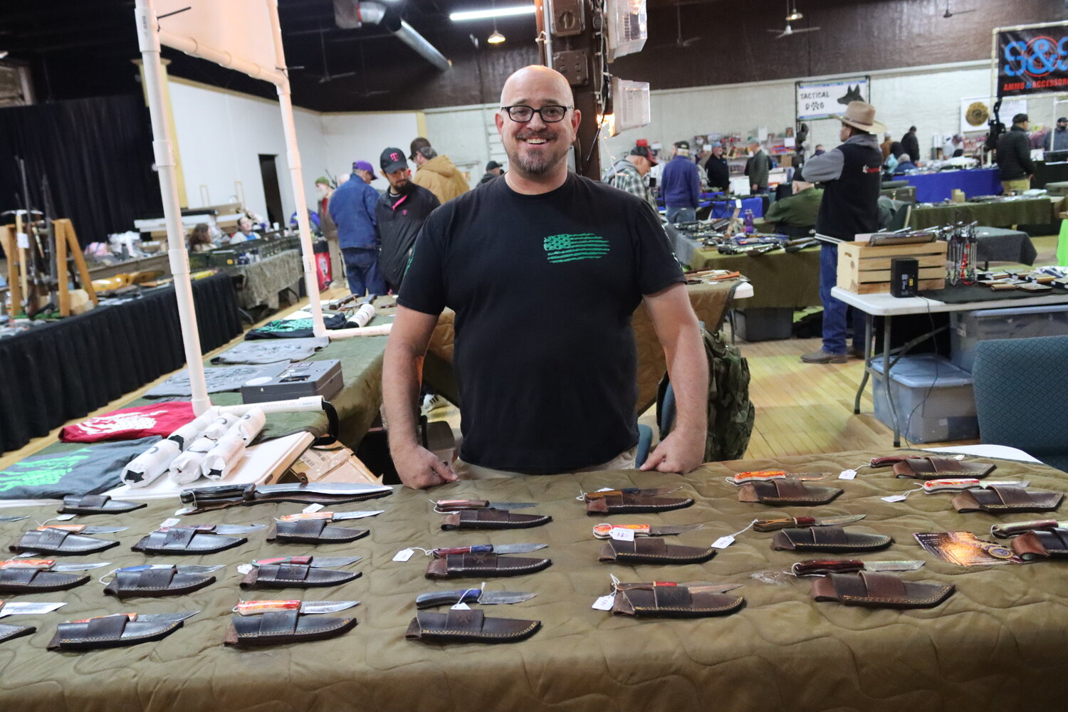 Kye White, founder of the nonprofit Veteran’s OATH selling knives and other goods to raise money for homeless veterans.