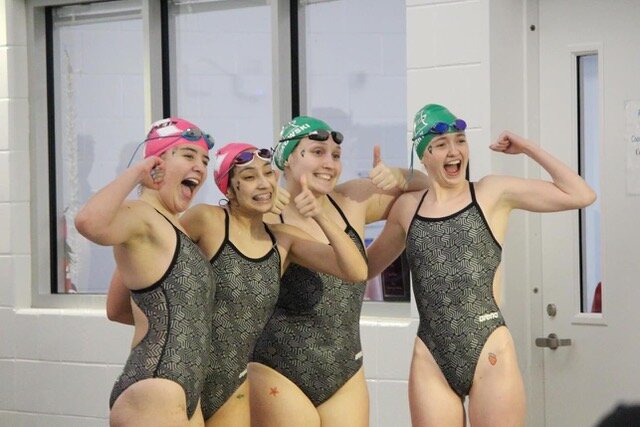 The Azle Lady Hornets 400-yard Freestyle Relay quartet of (from left) Kayley Brekel, Karla Rodrigues, Brooke Nowakowski and Peighton Berry set a school record at the District 5-5A Meet with a time of 4:12.95. They finished third and are four of the team's 10 regional qualifying participants.