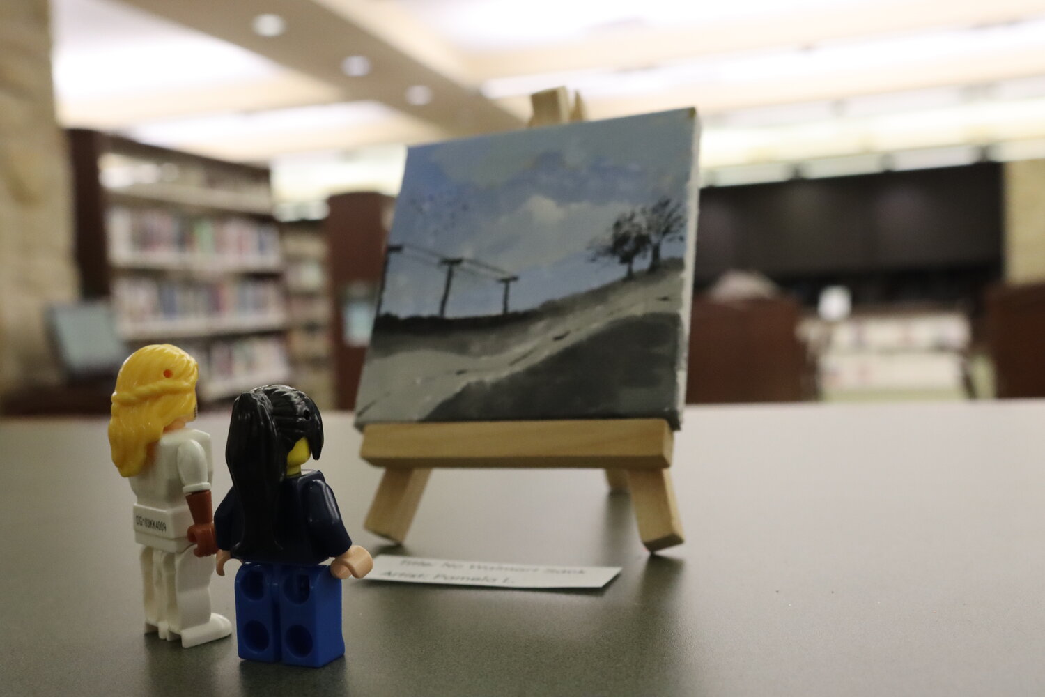 Library patrons can observe these tiny canvasses, painted during a Jan. 23 event, in the center of the library through Feb. 7.