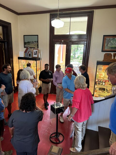 Everyone gathered in the lobby of the museum visiting with Ladye, Reggie, and Bill Gaither before they left for lunch at Table 127 in downtown Iuka.