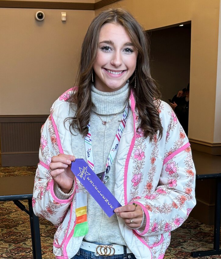 Sterling Durham wins the Top Designer Award at State competition.