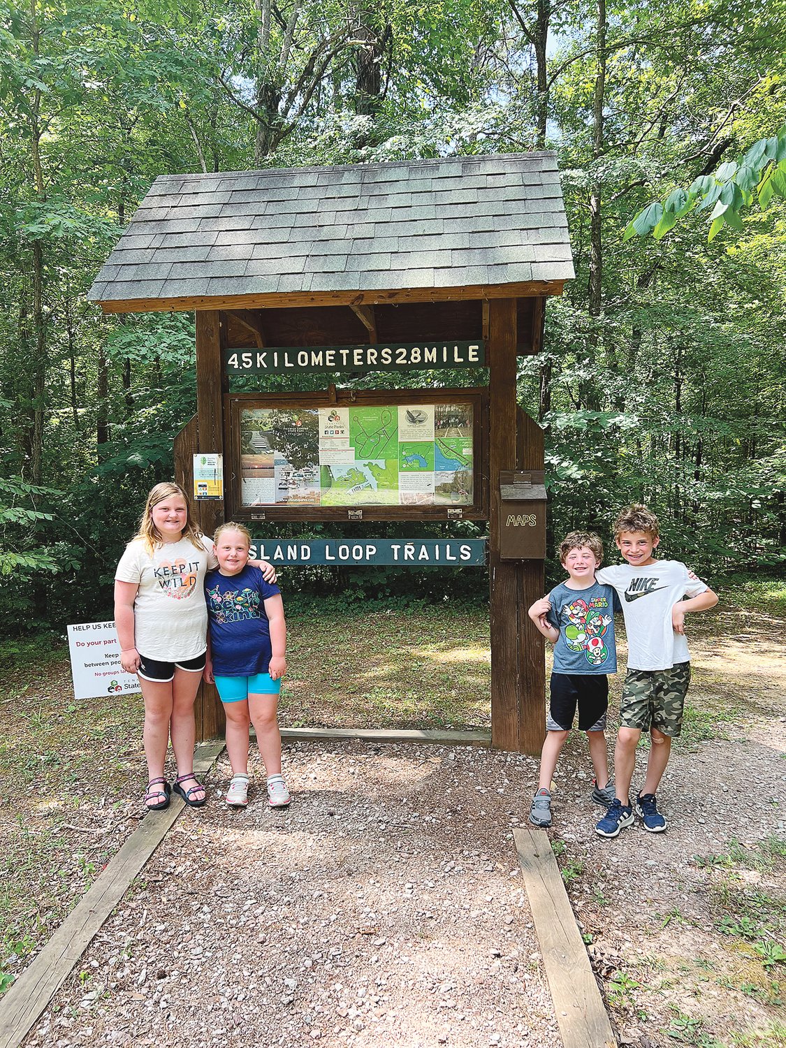 At the trailhead: Mary Ellis and Evelyn Gray with Carter and Collin Grodsky, children of Randy and Mary (formerly Mary Beard, of Iuka) Grodsky of Collierville.