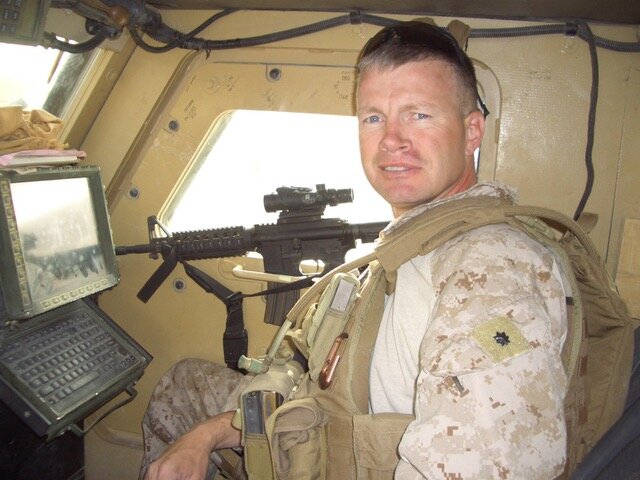 Pictured Above is Ghannon inside a Humvee While in Active Duty
