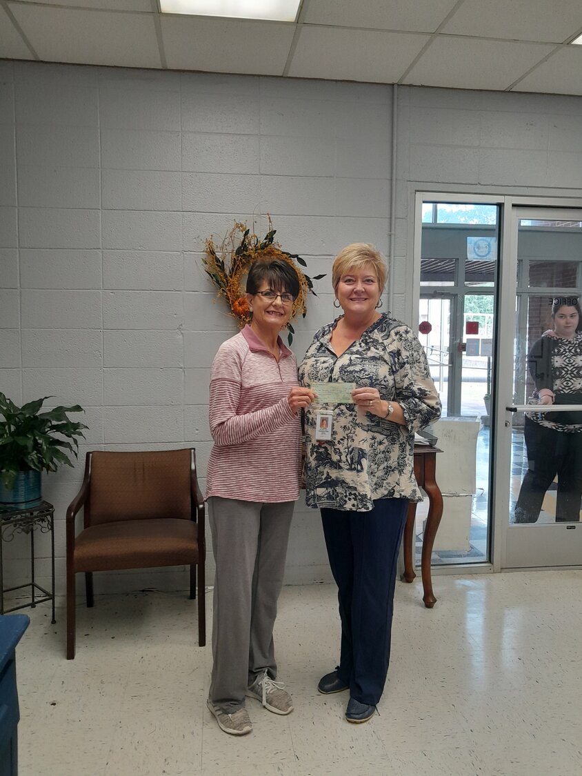 Iuka Middle School librarian, DD Lambert (right) recently received a donation check from Iuka Century Club member Beverly Estes (left). These annual donations from the 20th Century Club are used to purchase or replace books for our school library. Their generosity helps put books in our students’ hands.