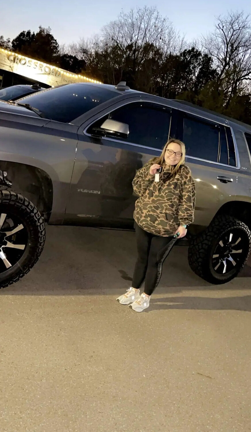 A picture Rast uploaded to various social media sites allegedly showcasing her in front of the 2020 GMC Yukon that was reported stolen.