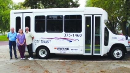 Pictured with the new 12-passenger bus are (left) Dan Carroll, Diane Bertrand, Manager and Van driver, and Frank Sheda.
