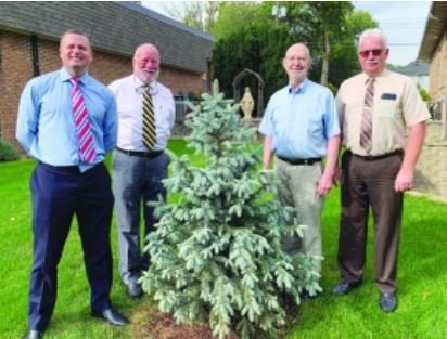Pictured at St. Mary&rsquo;s Catholic Church next to the new tree are (left) bank CEO Matt Ley, Chairman David Ley, Pat Gross, and Executive Vice President Ron Gentrup.