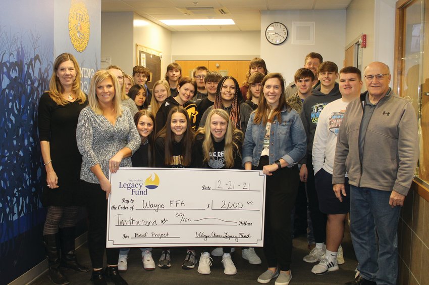 Legacy Fund board members Karen Longe, Karissa Hays and Bill Dickey (front) and Scot Saul (on the right in the back row) presented a check for $2,000 to Wayne FFA Advisor Toni Rasmussen and her students earlier this month.