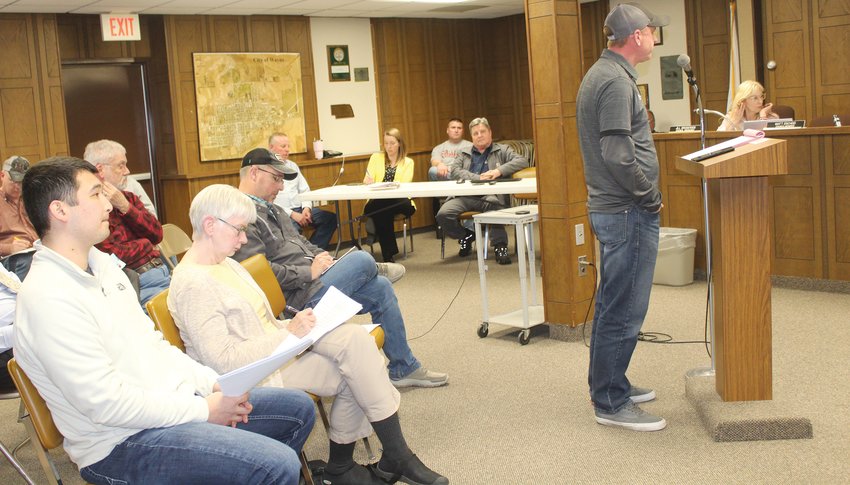 Cory Christensen with J. Perry Construction, Inc. (right) spoke to the Wayne City Council about the proposed apartment complex his firm plans to build in the southeast portion of Wayne.
