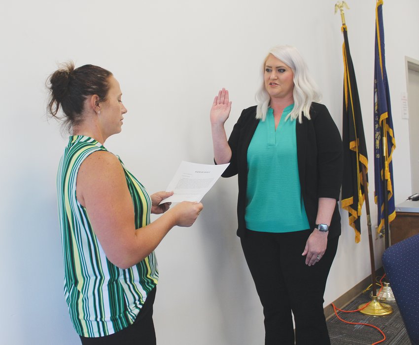 Wayne City Attorney Amy Miller (left) administers the oath of office to Brittany Webber, the newest member of the Wayne City Council, during Tuesday's council retreat.
