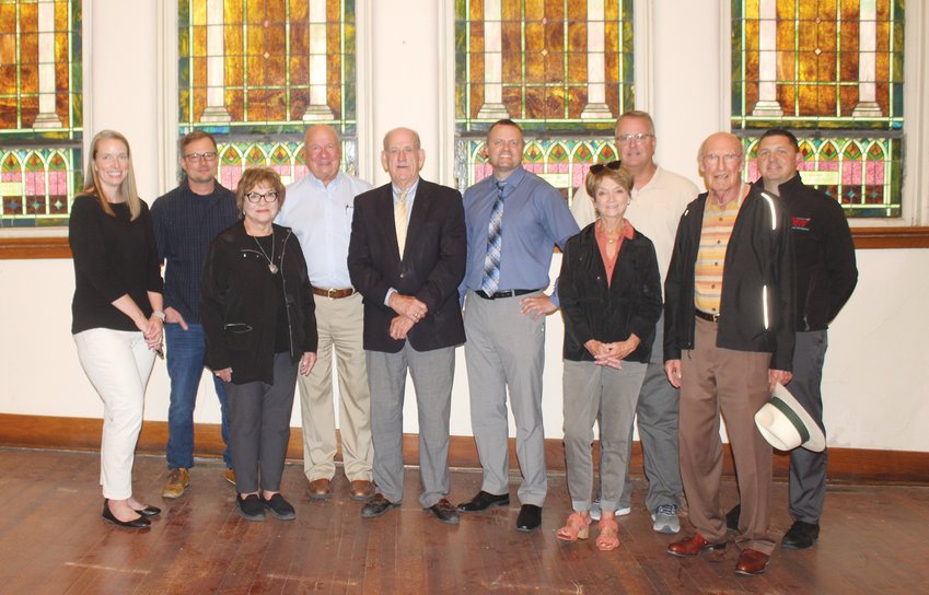 (Photo by Clara Osten)  Taking part in the 'groundbreaking' ceremony were left (Beth Porter, Roy Ley, Kaki Ley, Dave Ley, Carter Petersen, Matt Ley, Betty McGuire, Keith Moje, Rod Tompkins and Luke Virgil. They represent the investors, contractor and others instrumental in making the project possible.