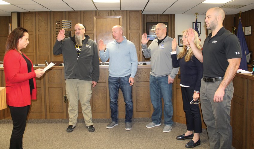 (Photo by Clara Osten)  City Attorney Amy Miller (left) administered the Oath of Office to council members Jason Karsky, Matt Eischied, Clayton Bratcher and Mayor Cale Giese during Tuesday's meeting of the Wayne City Council.
