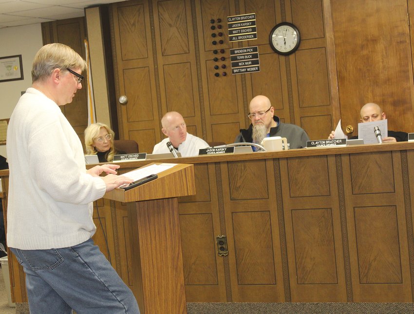 Roger Protzman with JEO (left) talked to the Wayne City Council about the estimated cost of renovating the Ameritas building on Main Street.