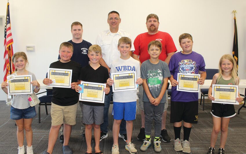 Those involved in the presentation were (front) Blayne Dunklau, Kirby Gubbels, Cohen Woehler, Aiden Kesting, Dexter McIntosh, Wyatt Dunklau and Maggie Sorenson. (back) Austin Frideres, Brent Doring and Nick Van Horn. Frideres and Van Horn were rescue personnel who responded to the incident.