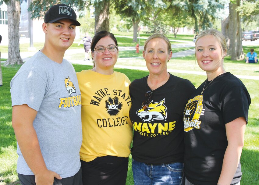 Following their moms&rsquo; footsteps to Wayne State College were (left) Landon Johnson and his mom, Jill Johnson, Audra Miller and her daughter, Logan Miller