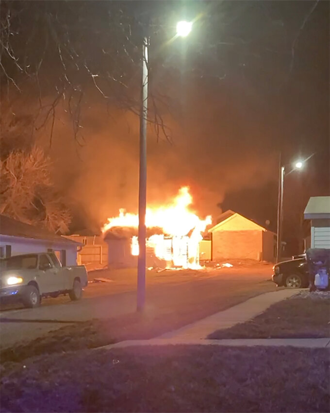 When firefighters arrived on the scene of a garage fire, they found the building fully engulfed in flames.