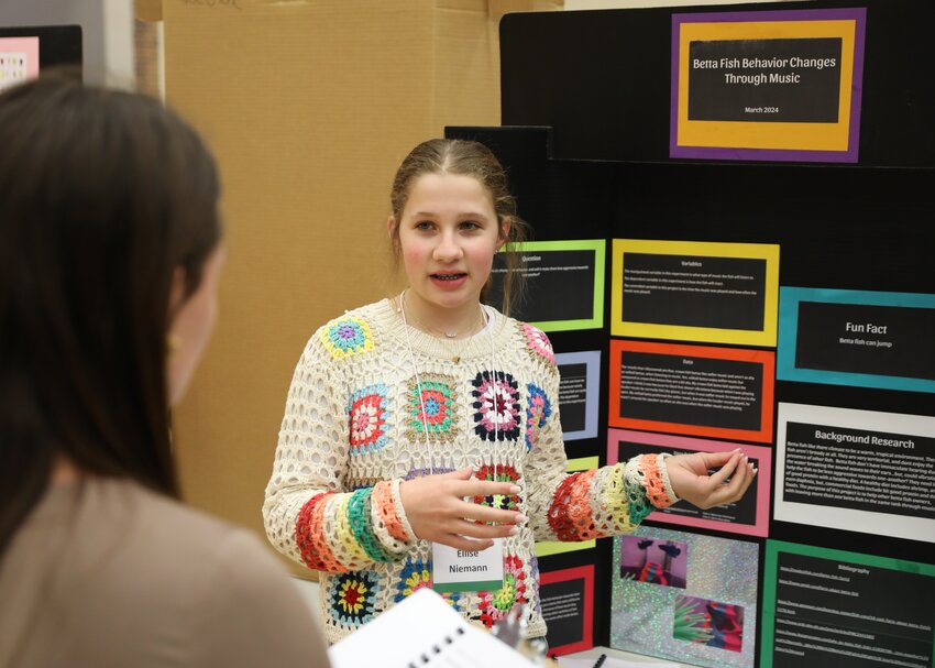 Ellise Niemann presents her science project &ldquo;Betta Fish Behavior Changes Through Music&rdquo; to a judge during the Nebraska Junior Academy of Science&rsquo;s Northeast Regional Science Fair at Wayne State College. Niemann is a seventh grader at Allen Consolidated Schools.