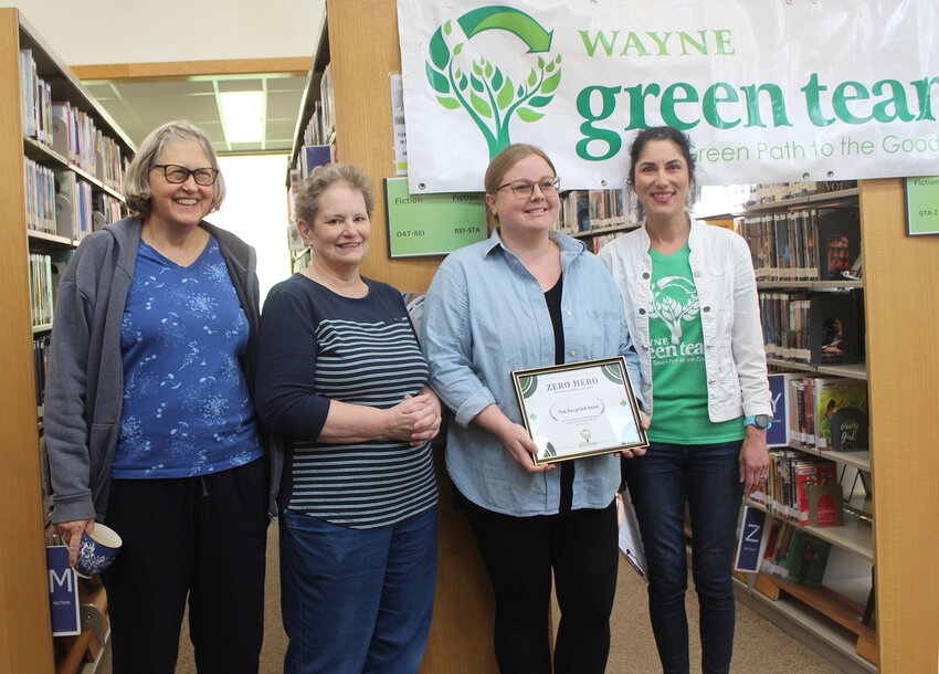 Sandy Brown presents the Wayne Green Team’s Zero Hero Award to members of the Friends of the Wayne Library, Mary Carstens (left) Terri Headley, and Amber Schlines, on behalf of The Recycled Read.