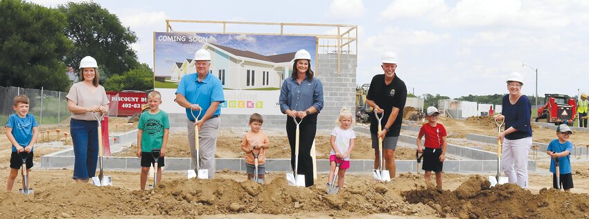 Future users of the Building Blocks Day Care also took part in the ground breaking. They are pictured with several board members. They include (left) Cade Harrington, Carol Benson &ndash; Board Member, Finn Dennis, Keith Knudsen &ndash; Board Treasurer, Brooks Brandow, Megan Pippitt &ndash; Board President, Emmary Dennis, Jeremy Christiansen &ndash; Board Member, Owen Pippitt, June Koester &ndash; Board Secretary and Oliver Pippitt.