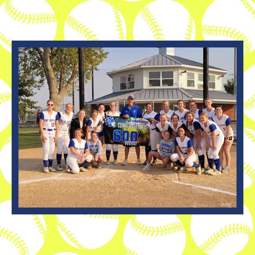 Wayne High softball Coach Rob Sweetland poses with this year's softball team following a win on Saturday. This marked Sweetland's 600th career win as the only coach in the Wayne High softball program.