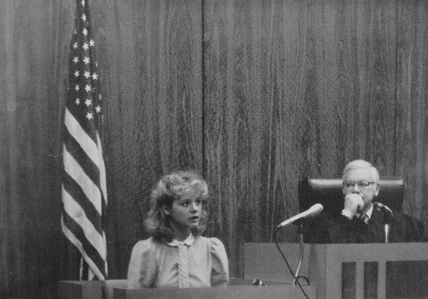 In this photo of the first Wayne High Mock Trial team, the caption says, &quot;Carefully listening to each question,&quot; Paula McCright responds to a lawyer's interrogation.