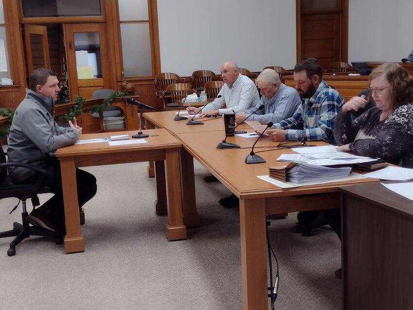 Luke Virgil, Director of Economic Development with Wayne America, Inc., (left) updated the Wayne County Commissioners on activities he and his office have been involved with.