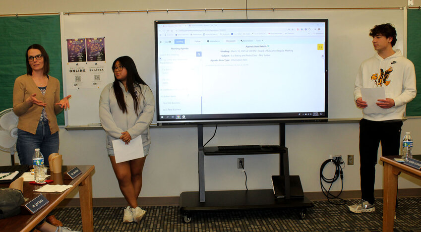 Brandy Saltzman (left) and Allie Davis explained to the board both the ways the Wayne Elementary Boosters earn money and how the funds are spent.