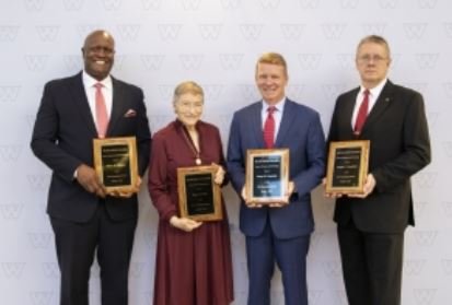 Wayne State College honored outstanding alumni on Oct. 1. They include (left) Barry E. Thomas, Mary E. Haas, Larry R. Guenther, and Joseph C. Guenther, ’88.