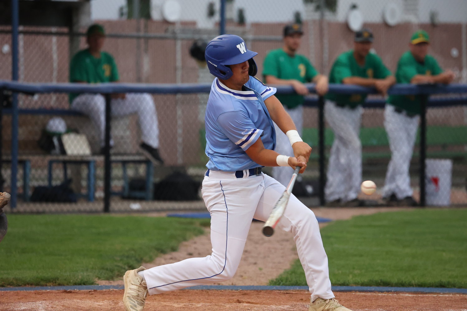 Brock Hopkins strokes a single for the Wayne Seniors during their home finale win over Wisner-Pilger-Howells-Dodge last week at Hank Overin Field. The Wayne Seniors will be the host team for the B-5 Area tournament that begins next Friday, July 22, at Hank Overin Field.