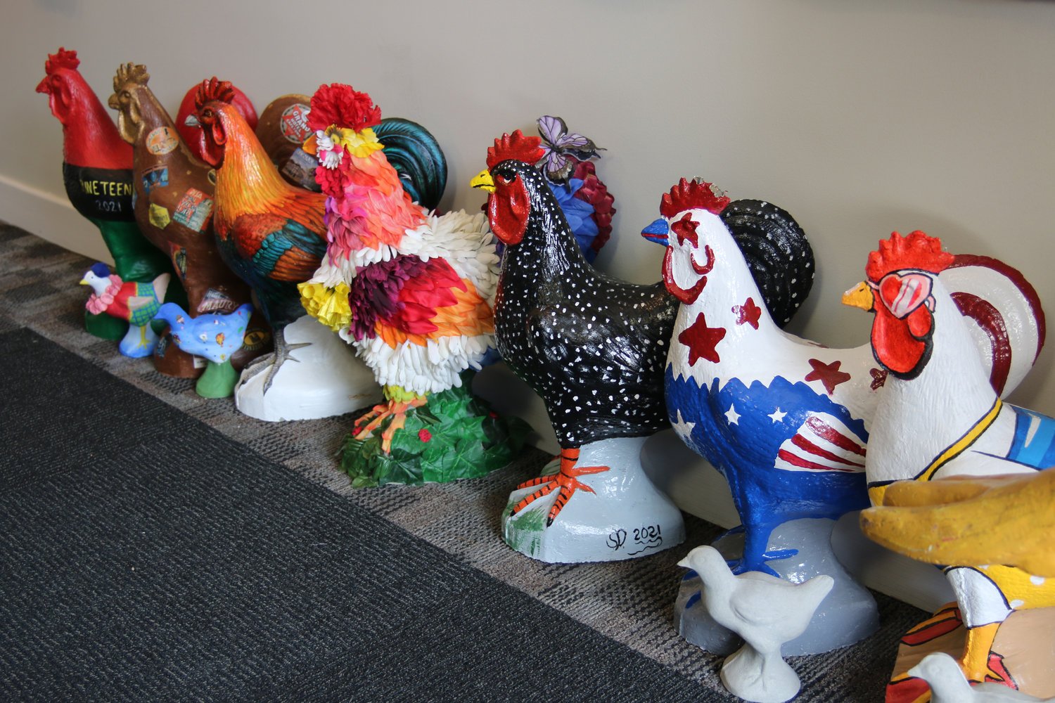 An assortment of cement chickens have already made their way back to the Wayne Area Economic Development Office for this year's auction.