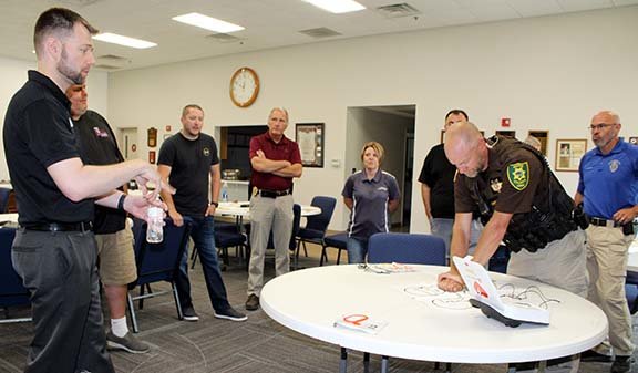 Wayne County Sheriff's Deputy Jesse Frank works with a "patient" during training on the defibrillators recently acquired through the Helmsley Charitable Trust.