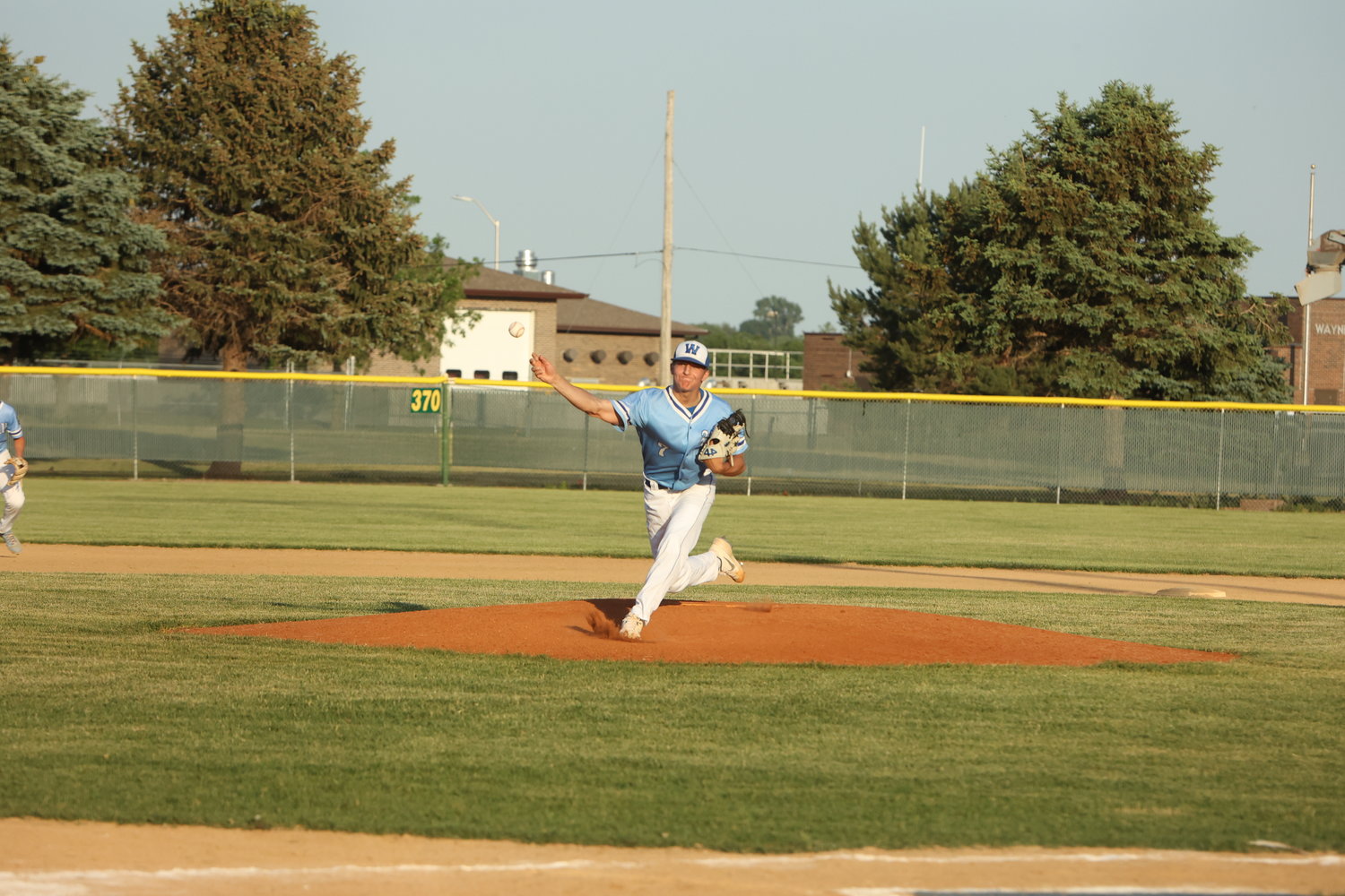 Blake Bartos fires a pitch home for the Wayne American Legion Seniors during their home win over Hooper-Scribner last week.