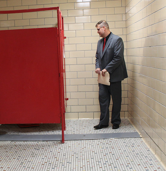 Winside Public Schools Superintendent Andrew Offner led a tour of the Winside School, explaining many of the mechanical and structural issues, such as a sinking floor in the restroom.