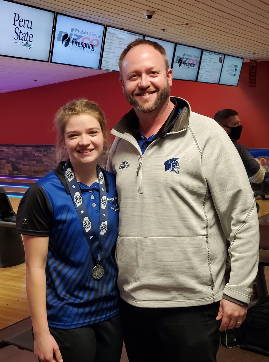 Jamie Janke is with coach Josh Johnson after finishing as state runner-up in girls singles at the NSAA Bowling Championships in Lincoln. (Photo by Tonya Janke)