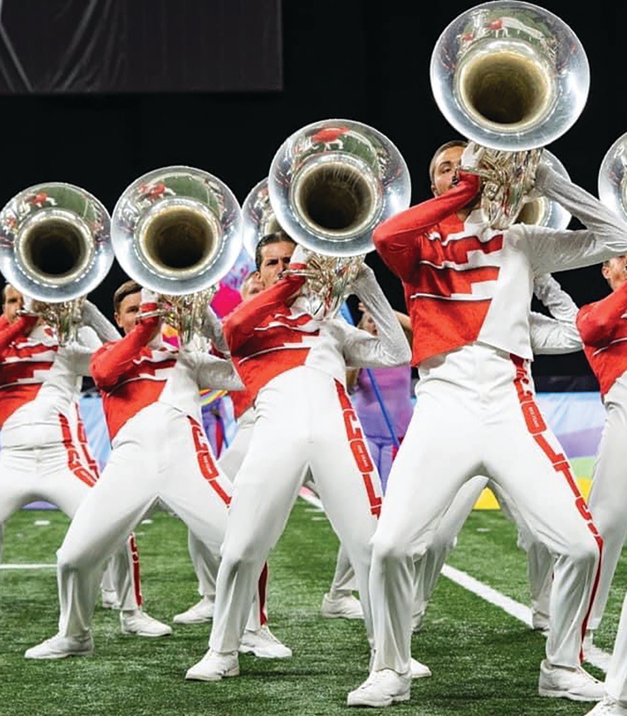 Baker (center) has been active in drum corps with the group the Colts since 2018.