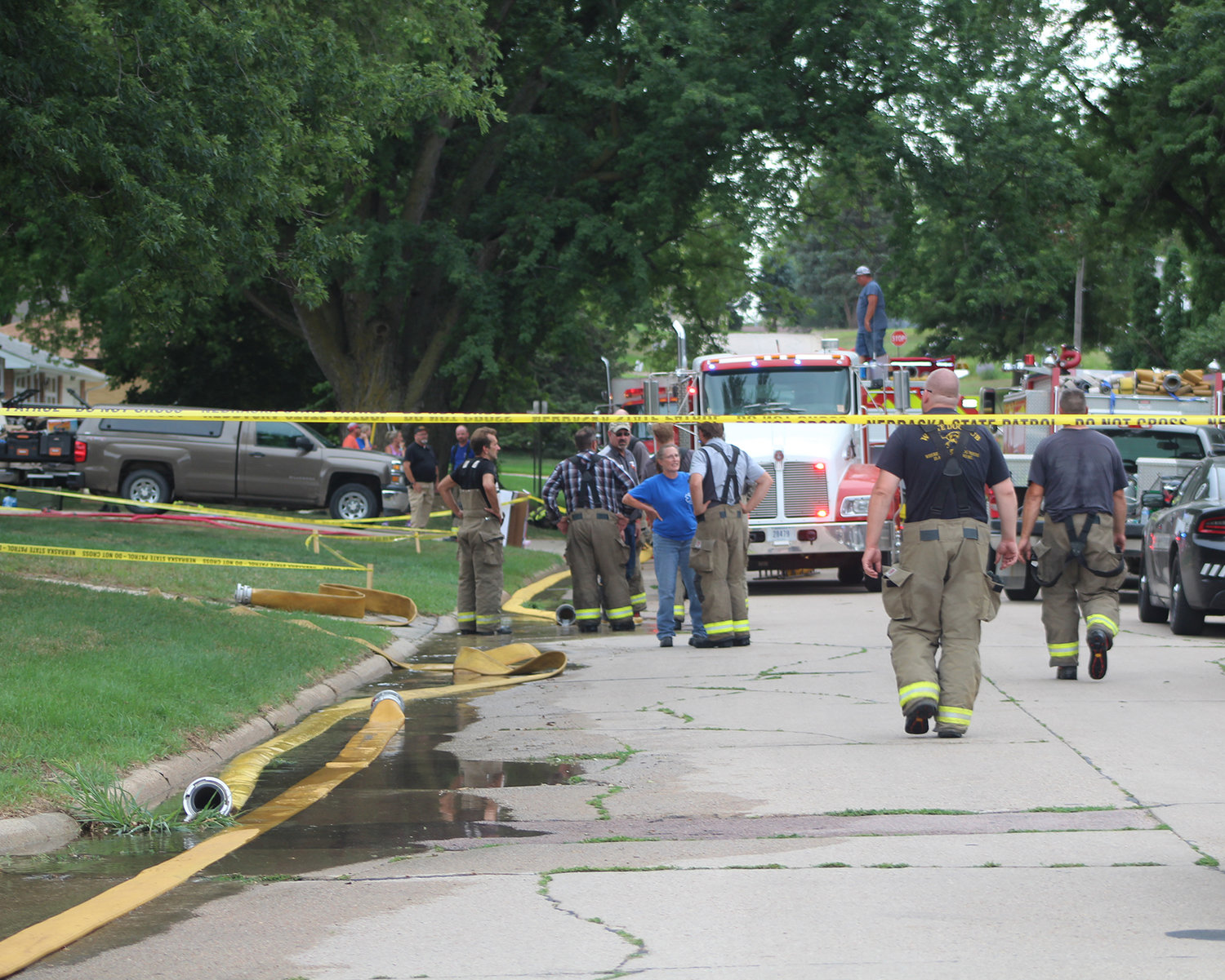 On Thursday, firefighters worked to put out a fire at 503 Elm Street. Investigators found three bodies inside the home.