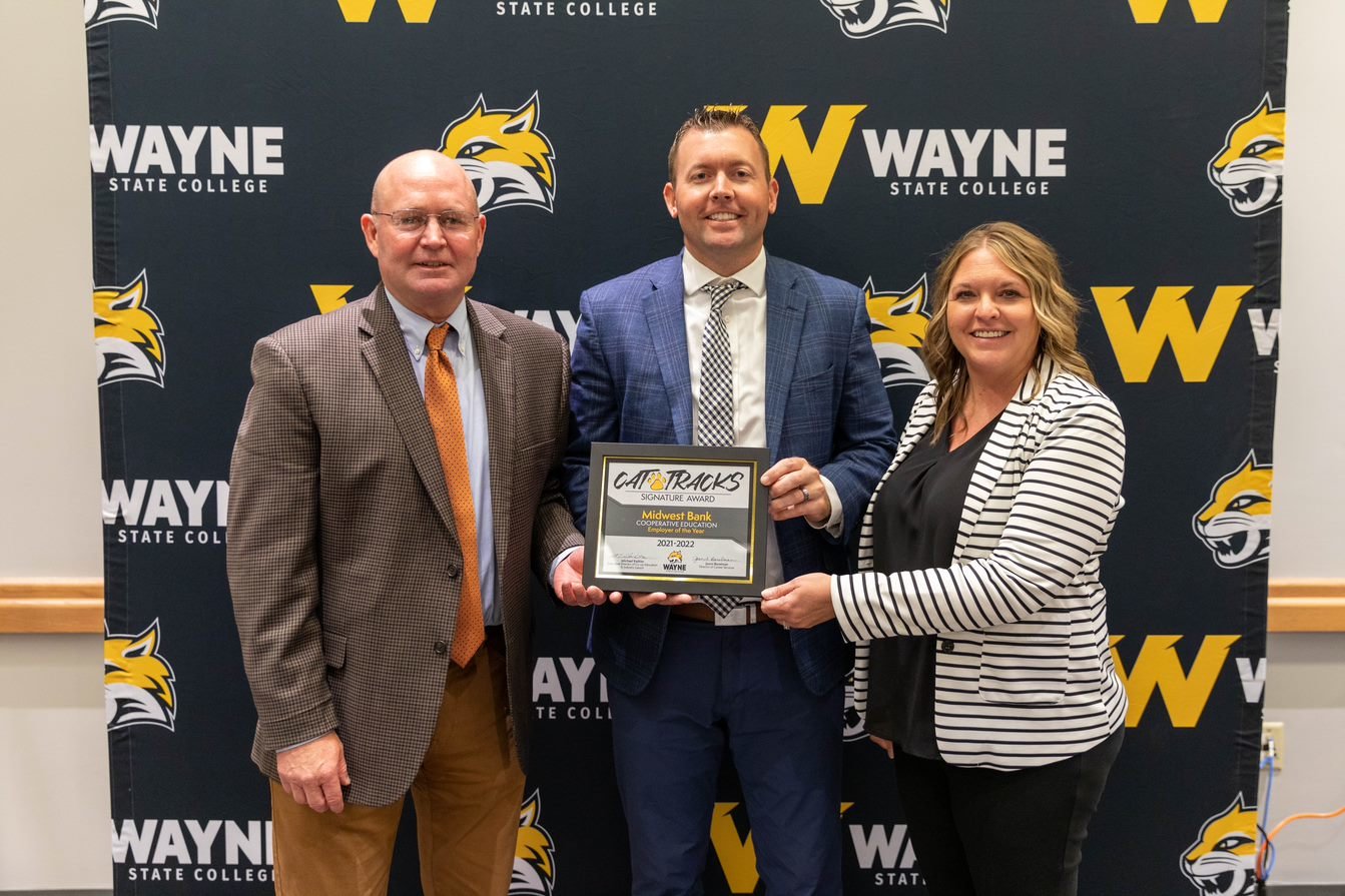 Doug Johnson, Midwest Bank President and CEO, Jason Love, Market President, and Amy Schroeter, Vice President, were on hand to accept the 2021-2022 Employer of the Year - Cooperative Education Award at the Sept. 25 Sophomore Parent-Student dinner.