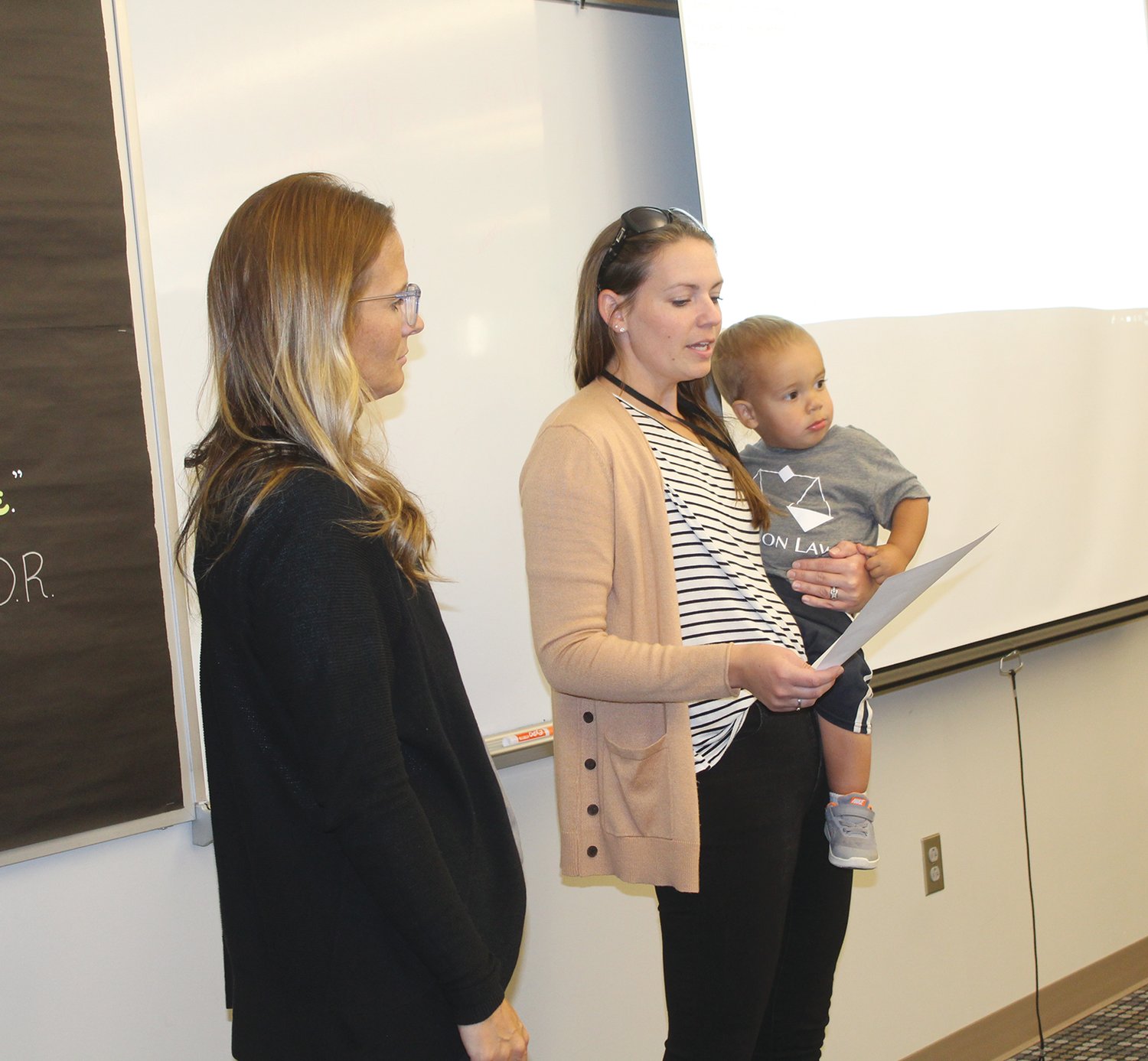 Kiley Koch (left) and Lindsey Knutson spoke during Monday's Board of Education meeting on the upcoming Job Shadow Day.
