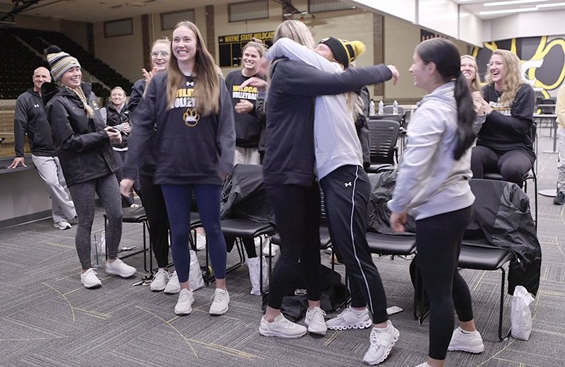 Members of the Wayne State volleyball react after being named host for the NCAA Div. II Central Region volleyball tournament. It is the first time the Wildcats have hosted the regional, which begins Friday at Rice Auditorium.