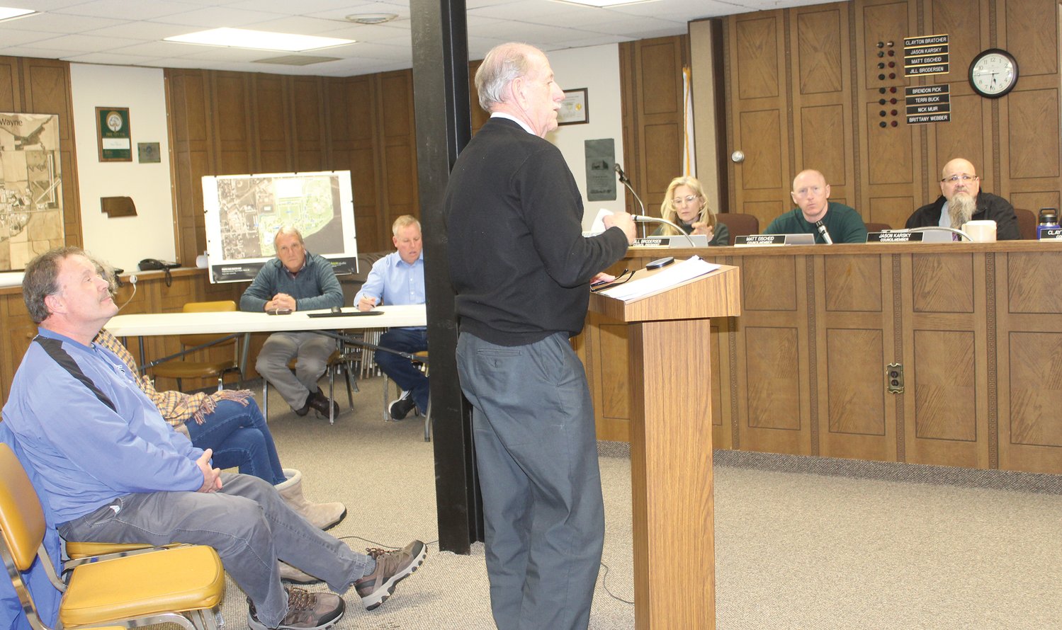 Cap Peterson with Northeast Nebraska Insurance Agency (at the podium) talked about the city's property insurance coverage at Tuesday's city council meeting.